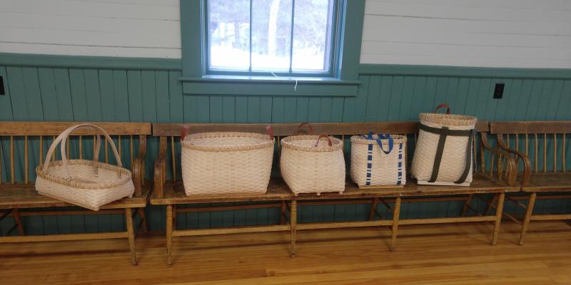 Picture of 5 baskets that were made during a basket class